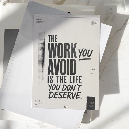 The Work You Avoid Is The Life You Don't Deserve motivational poster displayed on a desk, featuring bold minimalist typography and inspirational wall art design.