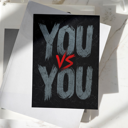 You vs You motivational poster displayed on a desk, featuring bold typography on a dark textured background, premium inspirational wall art print.