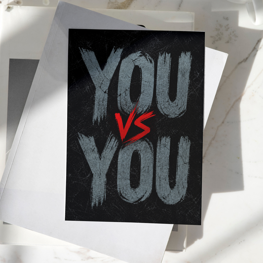 You vs You motivational poster displayed on a desk, featuring bold typography on a dark textured background, premium inspirational wall art print.
