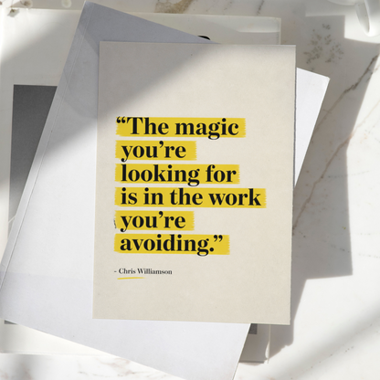 The Magic You're Looking For Is In The Work You're Avoiding motivational poster displayed on a desk, featuring minimalist typography with yellow highlighted text, premium inspirational wall art print.