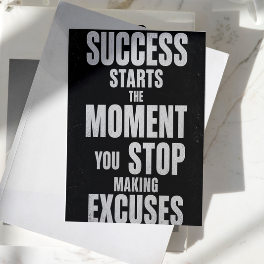 Success Starts The Moment You Stop Making Excuses motivational poster displayed on a desk, featuring bold typography and premium inspirational wall art design
