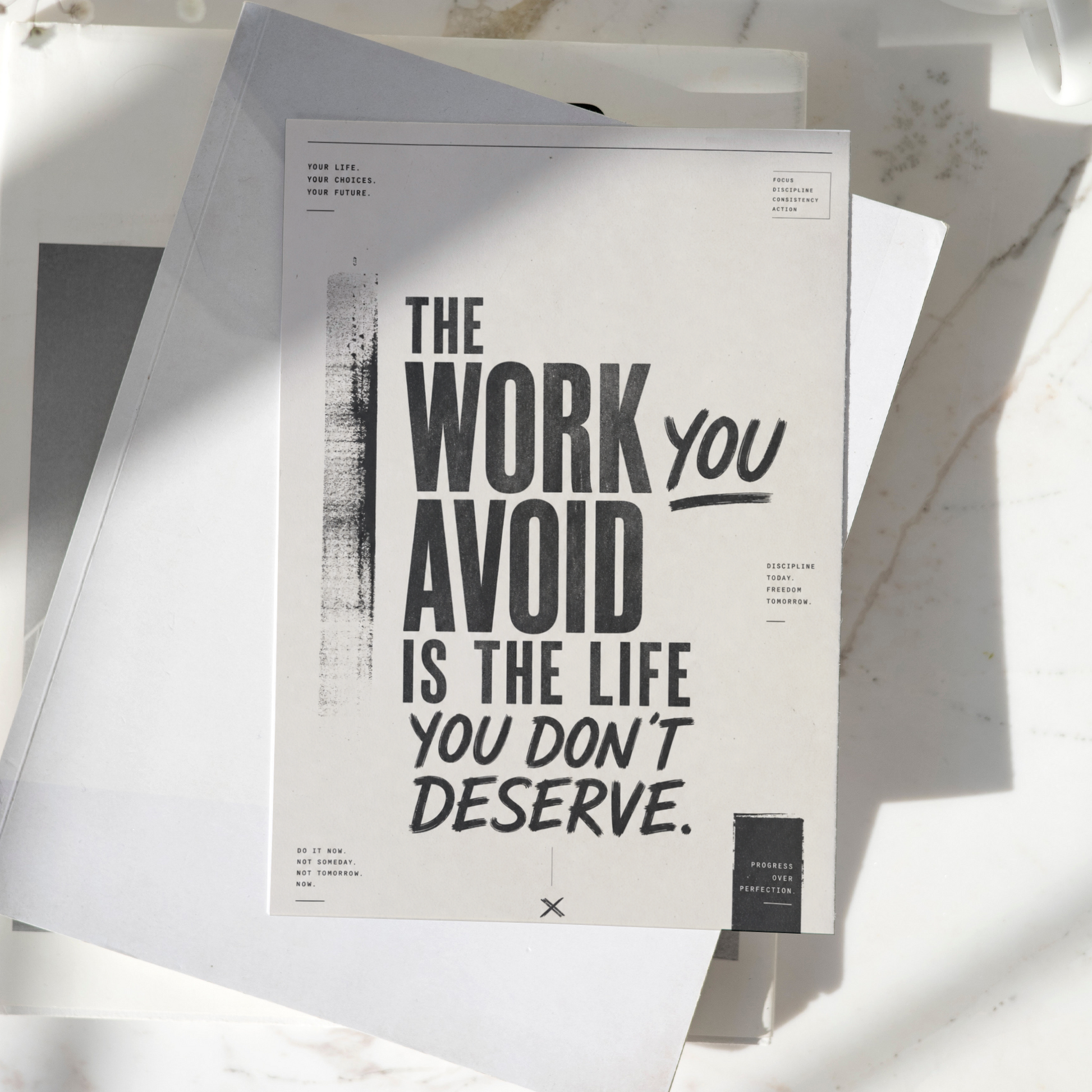 The Work You Avoid Is The Life You Don't Deserve motivational poster displayed on a desk, featuring bold minimalist typography and inspirational wall art design.