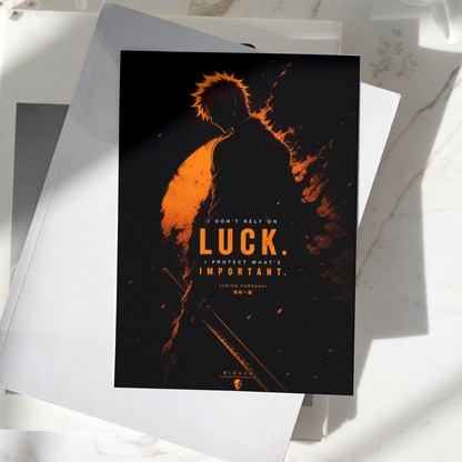 Ichigo Kurosaki Luck Is Important poster displayed on a desk, featuring dark orange silhouette artwork inspired by Bleach, premium anime wall art print
