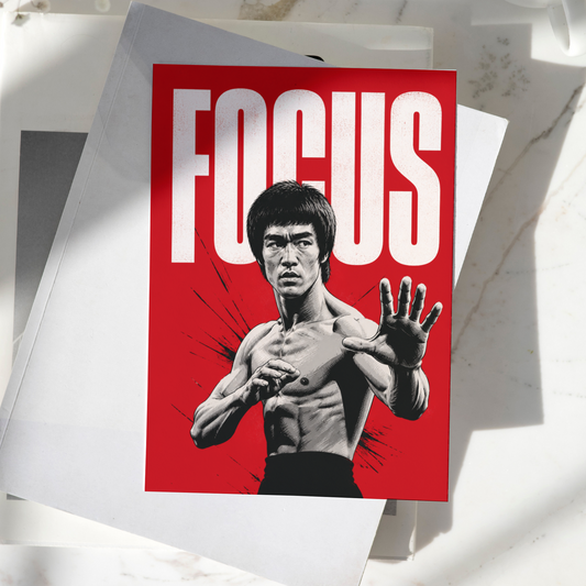 Bruce Lee Focus poster displayed on a desk, featuring the legendary martial artist in a fighting stance with bold red background, premium motivational wall art