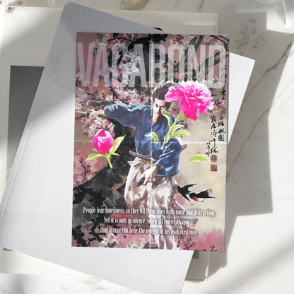 Vagabond poster displayed on a desk, featuring Miyamoto Musashi surrounded by cherry blossoms and traditional Japanese artwork, premium anime and manga wall art print
