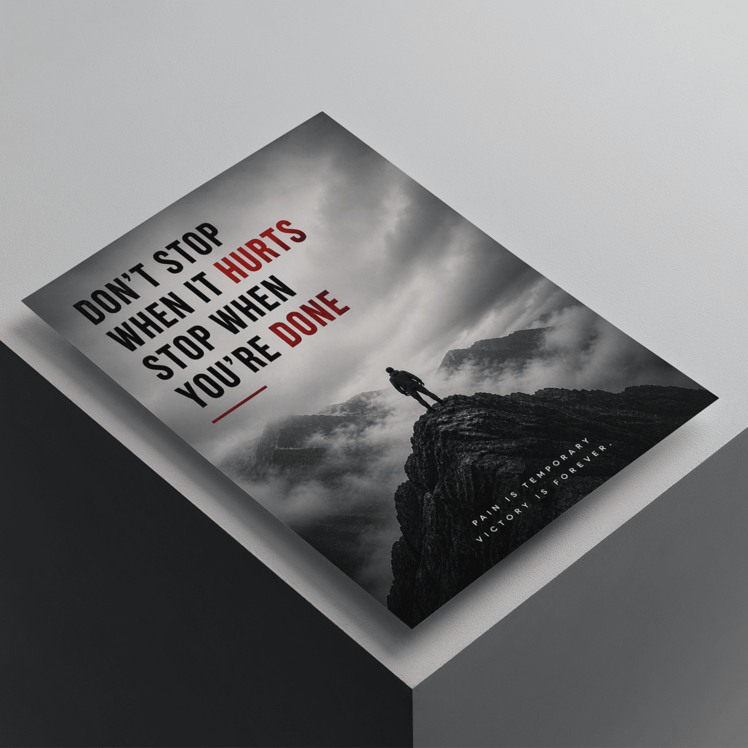 Don't Stop When It Hurts, Stop When You're Done motivational poster featuring a lone figure on a mountain cliff, premium inspirational wall art for discipline and perseverance