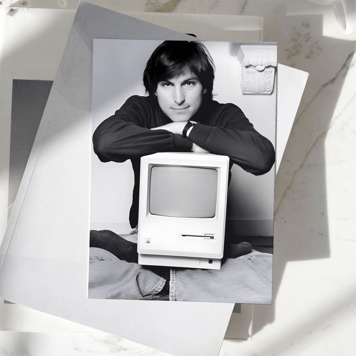 Steve Jobs poster featuring the Apple co-founder with a vintage Macintosh computer displayed on a desk, premium technology wall art print.