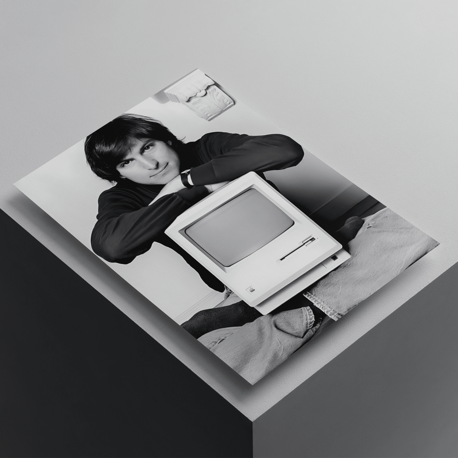 Steve Jobs black and white poster featuring the Apple co-founder with a vintage Macintosh computer, premium tech-inspired wall art print.