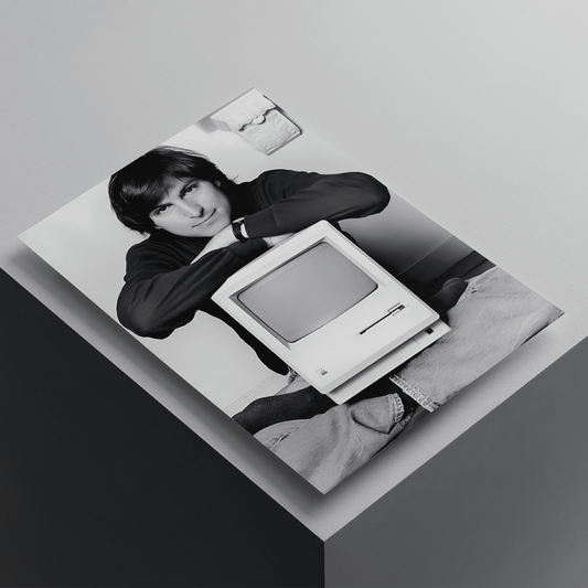 Steve Jobs black and white poster featuring the Apple co-founder with a vintage Macintosh computer, premium tech-inspired wall art print.