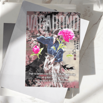 Vagabond poster displayed on a desk, featuring Miyamoto Musashi surrounded by cherry blossoms and traditional Japanese artwork, premium anime and manga wall art print