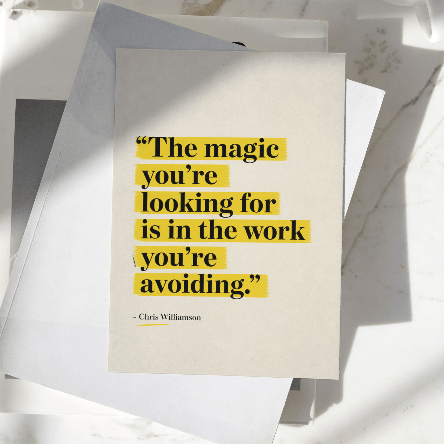The Magic You're Looking For Is In The Work You're Avoiding motivational poster displayed on a desk, featuring minimalist typography with yellow highlighted text, premium inspirational wall art print.