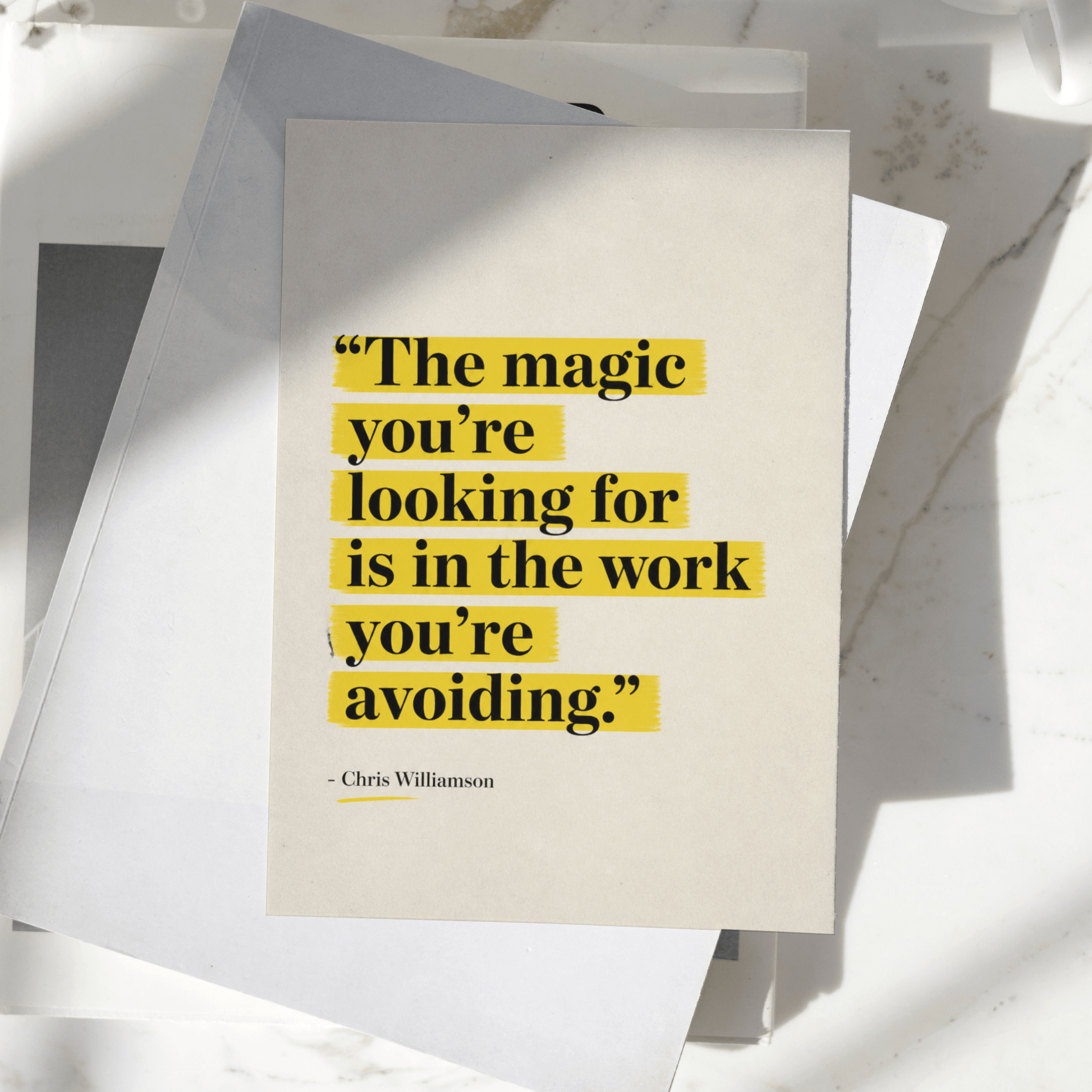 The Magic You're Looking For Is In The Work You're Avoiding motivational poster displayed on a desk, featuring minimalist typography with yellow highlighted text, premium inspirational wall art print.