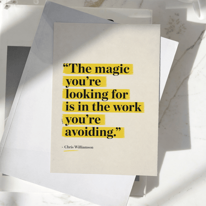 The Magic You're Looking For Is In The Work You're Avoiding motivational poster displayed on a desk, featuring minimalist typography with yellow highlighted text, premium inspirational wall art print.